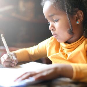 Image of a kid writing