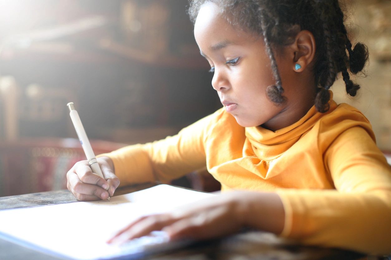 Image of a kid writing